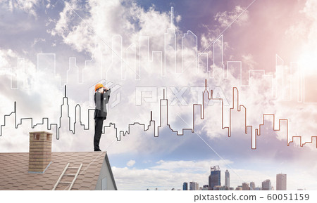 Engineer man standing on roof and looking in binoculars. Mixed media Engineer man standing on roof and looking in binoculars. Mixed media 60051159