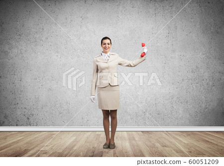 Woman keep at distance vintage red phone 60051209