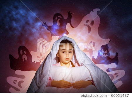 Excited girl hiding under blanket Excited girl hiding under blanket 60051487