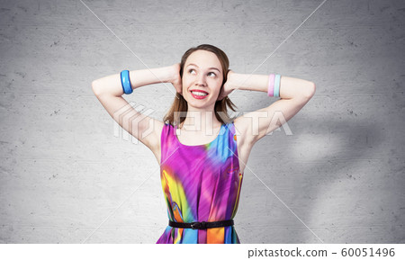 Redhead beautiful girl closing her ears with hands Redhead beautiful girl closing her ears with hands 60051496