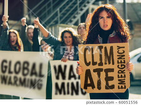 Young people protesting of climate emergency on the street 60051556