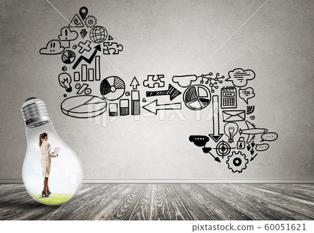 Businesswoman trapped in bulb Businesswoman trapped in bulb 60051621