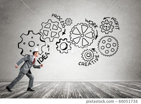 King businessman in elegant suit running in empty room with wooden floor 60051738