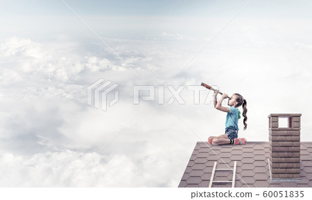 Concept of careless happy childhood with girl looking in spyglass Concept of careless happy childhood with girl looking in spyglass 60051835
