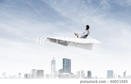 Businessman in aviator hat and goggles Businessman in aviator hat and goggles 60051985