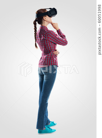Young woman wearing virtual helmet Young woman wearing virtual helmet 60051998