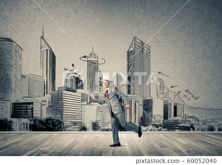 King businessman in elegant suit running and drawn cityscape silhouette at background 60052040