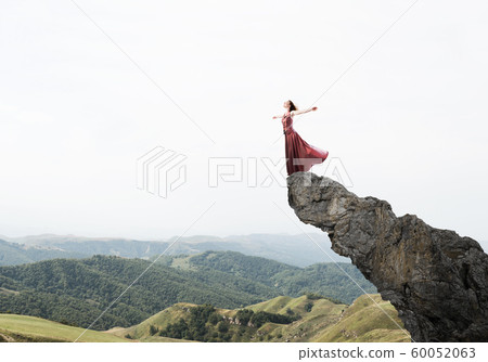Concept of freedom and happiness with girl enjoying this life Concept of freedom and happiness with girl enjoying this life 60052063