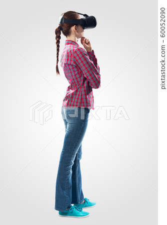 Young woman wearing virtual helmet Young woman wearing virtual helmet 60052090