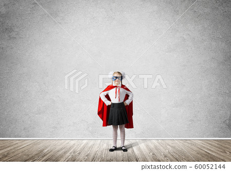 Girl power concept with cute kid guardian in empty room. Mixed media Girl power concept with cute kid guardian in empty room. Mixed media 60052144