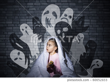 Excited girl hiding under blanket Excited girl hiding under blanket 60052833
