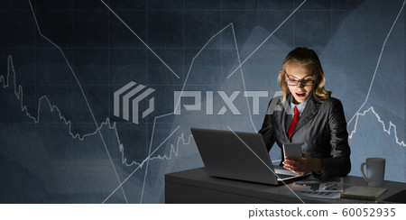 Surprised businesswoman in glasses at office desk Surprised businesswoman in glasses at office desk 60052935