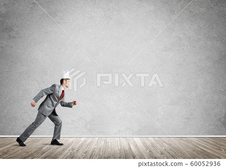 King businessman in elegant suit running in empty room King businessman in elegant suit running in empty room 60052936