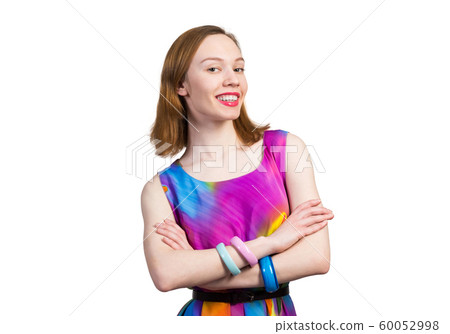 Joyful caucasian woman standing with folded arms Joyful caucasian woman standing with folded arms 60052998