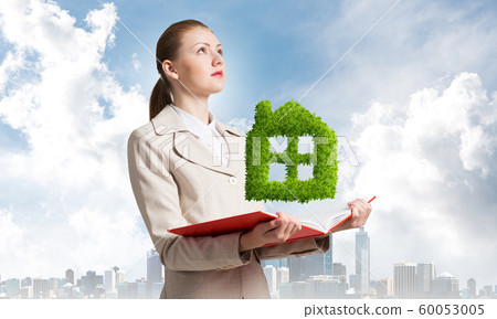 Woman with green plant shaped house Woman with green plant shaped house 60053005