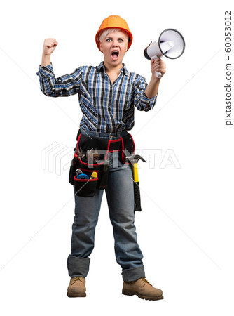 Female factory worker in safety helmet Female factory worker in safety helmet 60053012