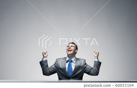Happy excited businessman celebrating victory Happy excited businessman celebrating victory 60053104