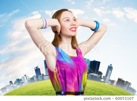 Redhead caucasian girl with closed ears looking up Redhead caucasian girl with closed ears looking up 60053107