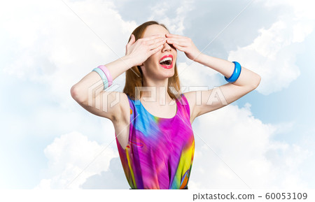 Redhead beautiful girl closing her eyes with hands Redhead beautiful girl closing her eyes with hands 60053109