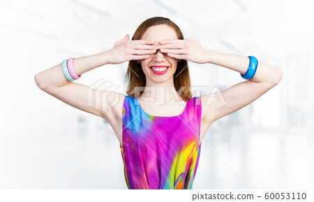 Redhead beautiful girl closing her eyes with hands Redhead beautiful girl closing her eyes with hands 60053110