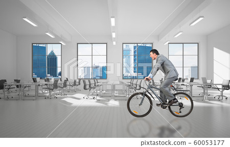 Businessman wearing business suit riding bicycle 60053177