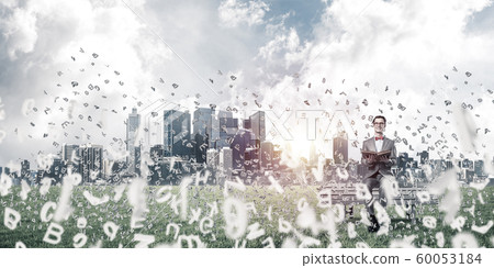 Young businessman or student studying the science and symbols fly around Young businessman or student studying the science and symbols fly around 60053184