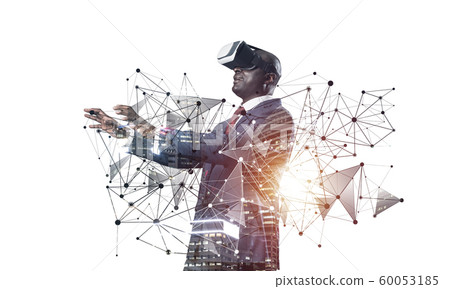 African businessman wearing VR headset working African businessman wearing VR headset working 60053185