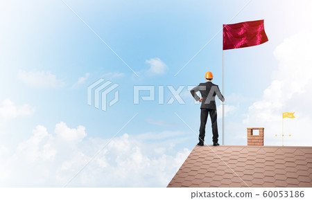Young businessman with flag presenting concept of leadership. Mixed media Young businessman with flag presenting concept of leadership. Mixed media 60053186