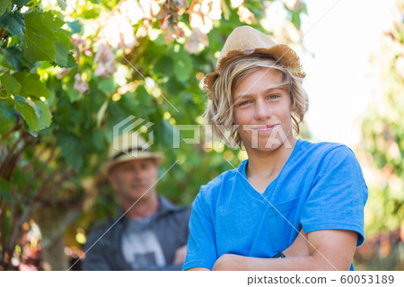 Portrait of guy in straw hat and t-shirt 60053189