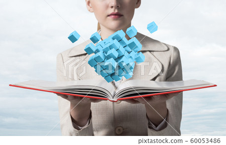 Young woman holding open notebook 60053486