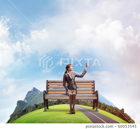 Business woman taking selfie photo or chatting Business woman taking selfie photo or chatting 60053545