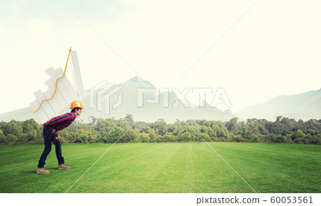 Engineer man carry progress graph Engineer man carry progress graph 60053561