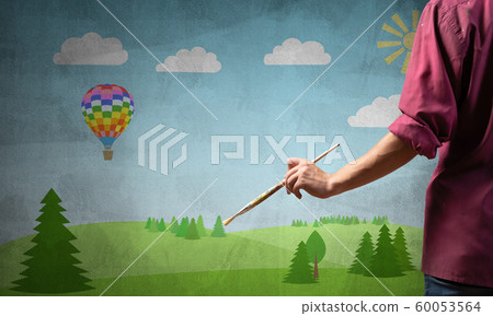 Close up artist hand holding paintbrush Close up artist hand holding paintbrush 60053564