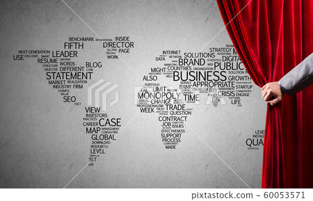World map behind drapery curtain and hand opening it World map behind drapery curtain and hand opening it 60053571