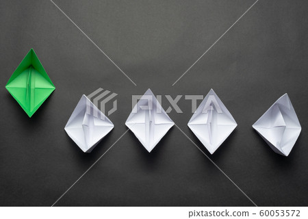 Row of paper ships on black background Row of paper ships on black background 60053572