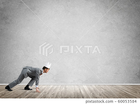 King businessman in elegant suit running in empty room King businessman in elegant suit running in empty room 60053584