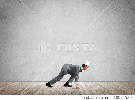 King businessman in elegant suit running in empty room King businessman in elegant suit running in empty room 60053589