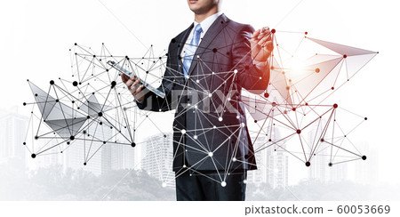 Businessman with documents pointing on network Businessman with documents pointing on network 60053669
