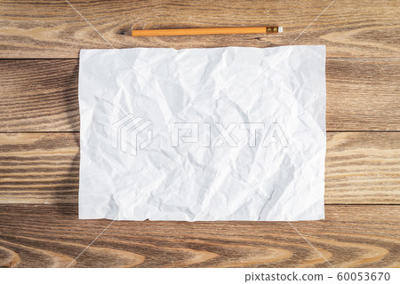 Sheet of paper lying on wooden table Sheet of paper lying on wooden table 60053670