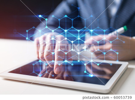 Business man works in office with tablet computer Business man works in office with tablet computer 60053739