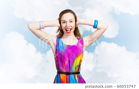 Redhead beautiful girl closing her ears with hands Redhead beautiful girl closing her ears with hands 60053747