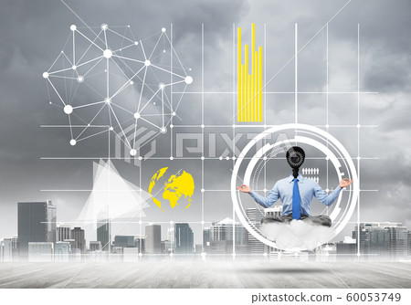 Camera headed man sitting in lotus pose on cloud against modern cityscape 60053749