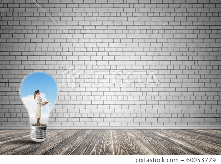 Businesswoman trapped in bulb Businesswoman trapped in bulb 60053779