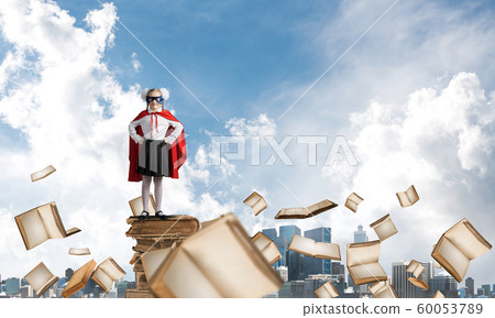 Girl power concept with kid wearing cape and mask and playing guardian. Mixed media 60053789