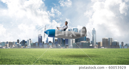 Businessman in aviator hat and goggles Businessman in aviator hat and goggles 60053929