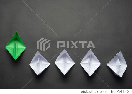 Row of paper ships on black background Row of paper ships on black background 60054190