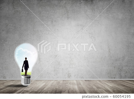 Businesswoman trapped in bulb Businesswoman trapped in bulb 60054195