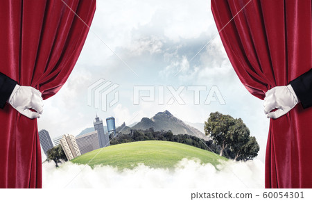 Modern cityscape behind drapery curtain and hand opening it Modern cityscape behind drapery curtain and hand opening it 60054301