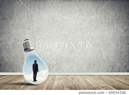 Businessman trapped in bulb 60054386