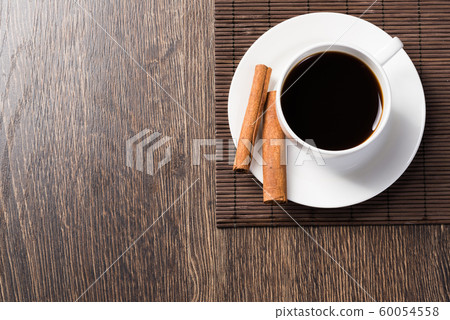 Cup of black coffee on wooden table 60054558